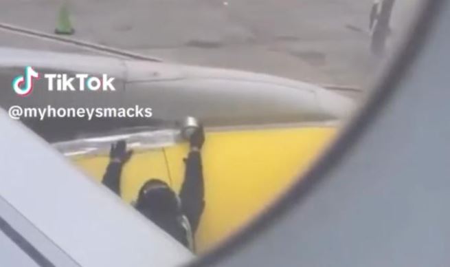 Video of Spirit Airlines worker putting tape on plane before takeoff goes viral