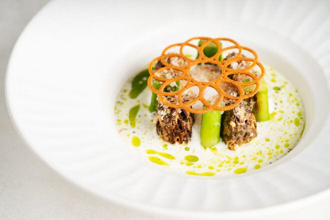 Morel (malai) with parmesan yakhni, asparagus, walnut and bianchetti truffle