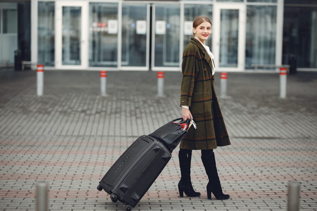 Woman pulling a suitcase