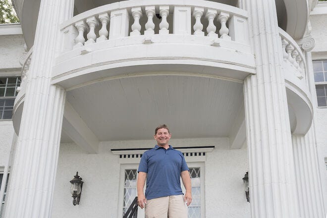 Matt Rogatz on the steps of The Manor on Green Lake