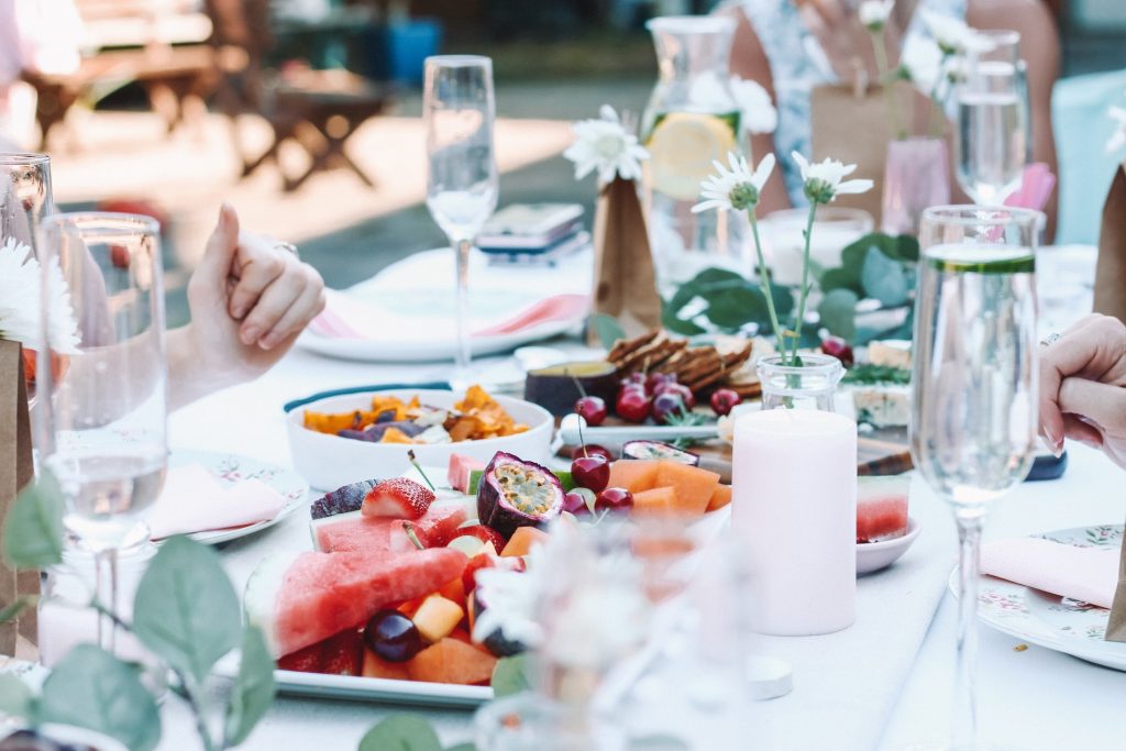 Outside table filled with food and drink