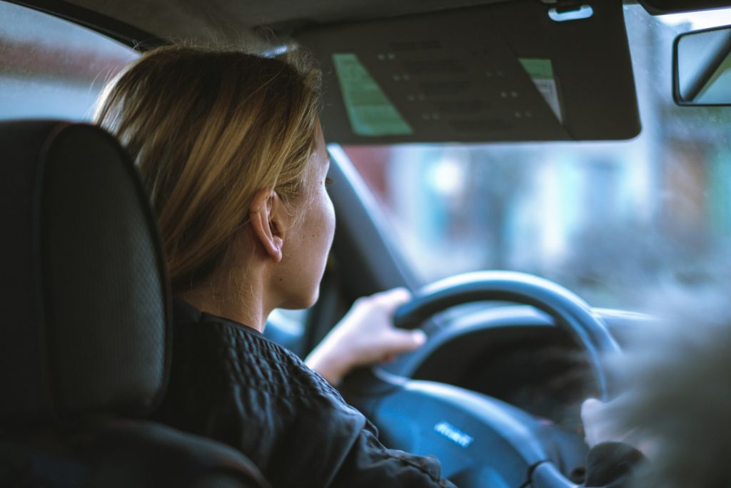 Woman behind the wheel of a car