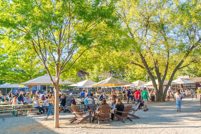 Enjoy a delicious beer in the sprawling outdoor space at The Olde Mecklenburg Brewery &amp; Biergarten